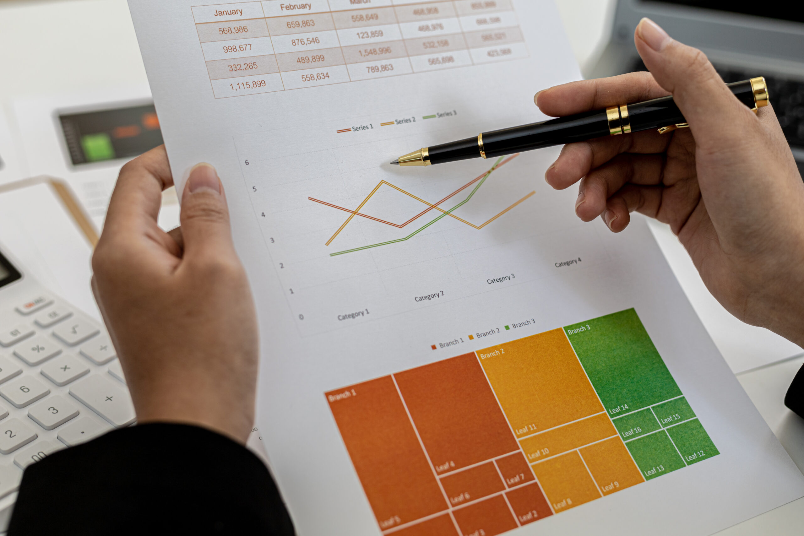 a business finance woman is reviewing a company's financial docu